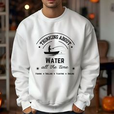 Our 'Thinking About Water' design on a sweatshirt is a great gift for the fisherman in your life. Comfortable and stylish, it's a must-have addition to any wardrobe. Due to monitor and lighting differences, all colors may vary slightly from what appears o   nline ABOUT -Unisex heavy blend crewneck sweatshirt is pure comfort. -Made from polyester and cotton. This combination helps designs come out looking fresh and beautiful. The collar is ribbed knit, so it retains its shape even after washing. Fishing Gift, Fishing Theme, Fishing Humor, Fishing Gifts, Water Design, Funny Sweatshirts, Fishing Shirts, Boating, Heavy Fabric