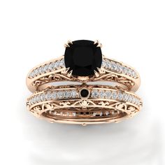 an engagement ring set with a black diamond in the center and white diamonds on each band