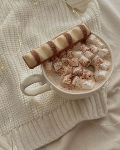 hot chocolate and marshmallows in a white cup