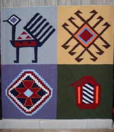 a multicolored rug with different designs on it