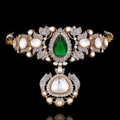 Let your style soar to new heights as you flaunt this handcrafted marvel, designed to capture attention! Introducing a beautiful set that promises to elevate your look with its unique blend of modernity and tradition. Crafted with CZ, kundan, and emerald stones, this beauty exudes a celestial charm that is simply unmatched. The set includes a necklace and a pair of stud earrings. Approximate earrings length is 0.5" Designed over high-quality brass as base metal with gold and silver plating.﻿ Mad Fusion Style Hand Set Chandbali Kundan Necklace, Fusion Style Kundan Chandbali Necklace, Festive Green Kundan Necklace With Diamonds, Festive Green Diamond Kundan Necklace, Designer Kundan Jeweled Jewelry, Luxury Kundan Jewelry Sets Hand Set, Elegant Designer Jewelry Sets With Stone Work, Designer Jeweled Jewelry For Diwali, Elegant Jewelry Sets With Stone Work For Designer Wear