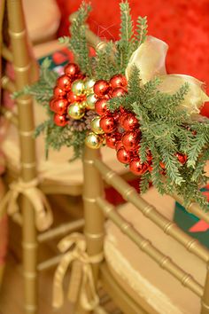 christmas decorations sit on top of wooden chairs