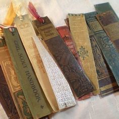 seven old books lined up on a bed