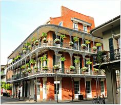 an old building with plants growing on the balconies and balconyes in new orleans