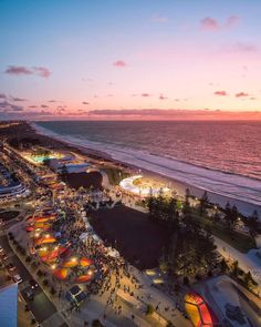 an aerial view of the beach at sunset