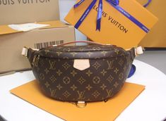 Fashioned in classic Monogram canvas and signed with a “Louis Vuitton Paris” leather patch, this uber-functional Bumbag transforms sportwear into the very definition of casual chic. Wear it as a belt bag, cross-body or over the shoulder for a jauntier look. Detailed Features 37 x 14 x 13 cm (Length x height x width ) Monogramted canvas and natural cowhide leather Cotton canvas lining Natural cowhide leather trim Gold colored metallic pieces 1 main compartment with double zip closure 1 adjustable belt (between 85 cm and 128 cm) 1 zipped back pocket 1 D-ring 1 natural cowhide leather patch Strap: Not removable, adjustable Strap Drop: 85.0 cm Strap Drop Max.: 128.0 cm Handle: Single The reference is either made in France, Spain, Italy or in the US. Bumbag Louis Vuitton, Louis Vuitton Bumbag, Classic Monogram, Wallet Accessories, Adjustable Belt, Leather Patches, Monogram Canvas, Wallet Case, Belt Bag