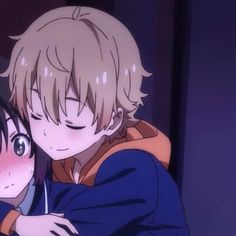 two anime characters hugging each other in front of a dark background, with one looking at the camera