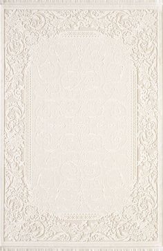 a white rug with an intricate design on it