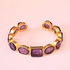 Wholesale Cuff Bracelet, Amethyst Cuff Bracelet, Gold Plated Cuff, Bezel Set Cuff Bracelet, Purple Stone Cuff, Birthday Gift Ideas Product Details Item Code: BJBB-2307 Stone Name: Amethyst Stone Shape : Pear, Round, Oval and Cushion Metal: 18K Yellow Gold Plated Over Brass Bracelets Inner dimension: 2.50" inch - Adjustable Note :- This bangles you will receive may vary slightly in color from the images because these are natural gemstones and vary to each other every single time and it is not possible to get the same color what is showing in the images. Images are for reference to get an idea of the similar color you will get. Shipping Info: All my items are safely and nicely packaged and shipped in a beautiful plastic box with bubbles wrap. The package is sent via international registered Cuff Bracelet Gold, Gold Bracelet Simple, Handmade Jewelry Bracelets, Mens Gold Bracelets, Bracelets Gold Diamond, Brass Bracelet, Bracelets Handmade Beaded, Purple Stones, Birthday Gift Ideas