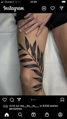 a woman's leg with black leaves on it and the words instagramn written in