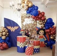 wonder woman themed birthday party with balloons and decorations