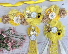 some yellow and white ribbons with flowers on them