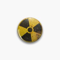 a yellow and black hazard symbol on a white background