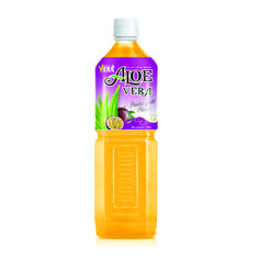 an orange juice with aloe vera on the side