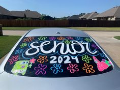 a car that has been decorated with flowers and the word sewf on it