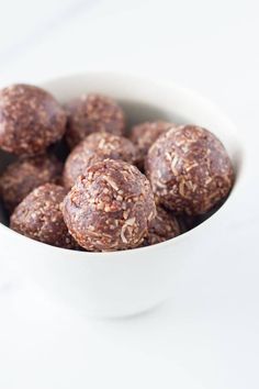 a white bowl filled with chocolate energy bites