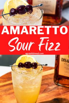 the amaretto sour fizz cocktail is garnished with cherries and lemon