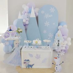 a frozen princess themed birthday party with balloons, cake and desserts on the table