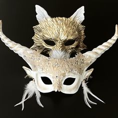 Tap into your animal sides with snarls and horns. The white and gold pairing with accessories is perfect for festivals. Mask Ball Party, Black And Gold Masquerade Mask, Purple Masquerade Mask, Blue Masquerade Mask, Red Masquerade Mask, Mask Wolf, White Masquerade Mask, Masquerade Mask Women, Phantom Mask