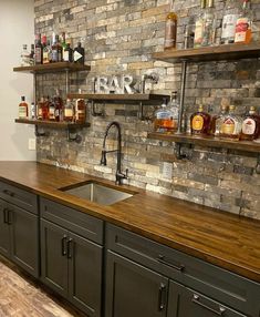 a kitchen with brick wall and wooden counter tops