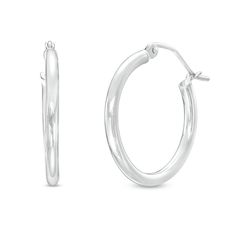 Dressed up or down, these 14K white gold hoop earrings are a classic fashion choice that complements any attire with ease. Created in 14K white gold Each earring features a 20.0mm-wide tubular hoop gleaming with a bright polish. These earrings secure with latch backs. Classic White Hoop Earrings With Polished Finish, Classic White Gold Hoop Earrings Gift, Classic Round Hypoallergenic Hoop Earrings, Classic White Gold Hoop Earrings For Anniversary, Classic White Gold Huggie Earrings, Classic White Huggie Earrings, Classic Hypoallergenic Round Hoop Earrings, Classic Hypoallergenic Hoop Earrings, Classic Sterling Silver Hoop Earrings With Ear Wire