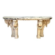 a marble table with carvings on the top and bottom, sitting against a white background