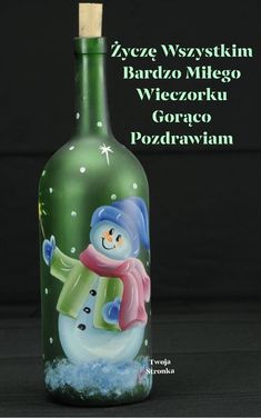 a bottle with a snowman painted on it and the words, zyece wyszystim bardzo mikgo wieczzek korowk goroku