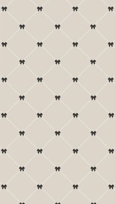 an abstract pattern with black bows on a light gray background, suitable for wallpaper or fabric