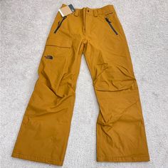 Size : S Inseam 28” Total Long 41” Standard Fit , Dryvent Ski Pants This Fabric Is Fully Waterproof, Windproof And Breathable. Orange Bottoms With Pockets For Outdoor, Casual Ski Pants For Sports, Functional Brown Bottoms For Outdoor Activities, Sporty Snowboarding Pants With Pockets, The North Face Casual Cargo Pants For Outdoor, Casual The North Face Cargo Pants For Outdoor, Waterproof Casual Skiing Pants, Full Length Outdoor Pants For Ski Season, Outdoor Full-length Ski Pants