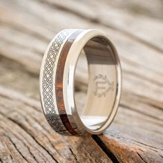 a wedding ring with an intricate design on the inside and inlayed to it