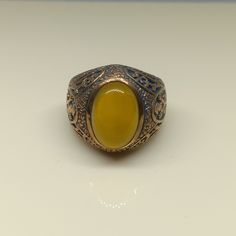 This empower ring is an awesome design bronze ring with an oval yellow Aqeeq. It is an awesome Masonic icon design bronze ring with a cabochon Yellow Aqeeq. It is an awesome design bronze ring. It has designed and made in Thailand. It is for the people who love to collect rare limited edition items and who wants to be different. This ring is one of a kind item for you. Material: Bronze The Main Stone: Yellow Aqeeq (Yellow Agate) Stone Color: Yellow Stone size: 10 x 14 mm. Ring weight approx.: 8 Bronze Oval Rings As Gifts, Bronze Oval Rings For Gift, Oval Bronze Rings For Gift, Yellow Oval Cabochon Ring For Gift, Yellow Agate, Bronze Ring, Yellow Stone, Ring For Men, Antique Design