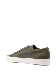 Original Achilles leather sneakers from COMMON PROJECTS featuring olive green, calf leather, smooth grain, signature numbers motif, front lace-up fastening, round toe, branded insole and flat rubber sole. This item is in size 40 and the color is Luxury Green Low-top Sneakers, Classic Green Sneakers With Textured Sole, Classic Green Sneakers With Vulcanized Sole, Green Leather Sole Sneakers For Streetwear, Green Sneakers With Leather Sole For Streetwear, Luxury Green Custom Lace-up Sneakers, Luxury Custom Green Lace-up Sneakers, Modern Green Sneakers With Stitched Sole, Classic Green Sneakers With Branded Insole