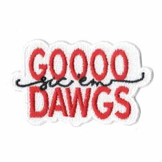 the words good and dawgs written in red ink on a white sticker