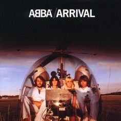 four people sitting in front of a helicopter with the words abra arrival on it