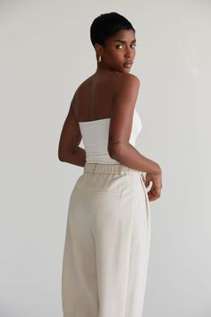 A minimal and simple strapless design, made from our signature double layered fabric, this top curves to the body to provide a sculpted silhouette. Perfect for any occasion, yet versatile enough to be styled with any bottoms. Summer Tube Top, Summer Tube, Summery Outfits, Layered Fabric, Summer Staples, Dress Trousers, Signature Collection, Tube Top, Summer Wardrobe