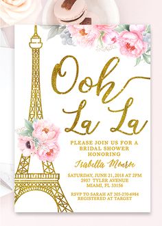 the eiffel tower with pink flowers on it is shown in gold and white