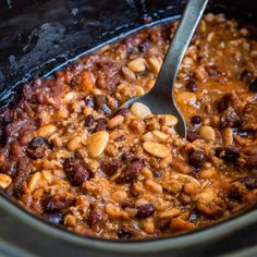 a slow cooker filled with chili and beans