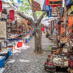 an outdoor market with lots of items for sale