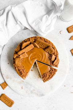 a piece of peanut butter pie on a white plate with a slice missing from it