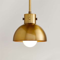 an image of a light that is hanging from the ceiling with a white wall in the background