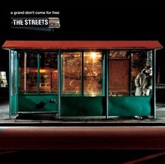 an advertisement for the streets featuring a man standing in front of a green bus stop