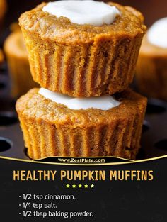 two pumpkin muffins stacked on top of each other with icing in them