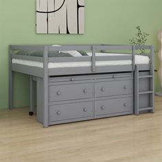 a gray bunk bed with drawers underneath it in a green room next to a painting on the wall