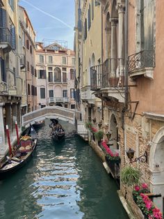 two gondola boats on a narrow canal in venice