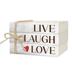 two wooden blocks with the words live laugh love written on them, tied in twine