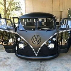 an old vw bus parked in front of a building