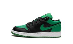 The Air Jordan 1 Low GS “Lucky Green” is the youth sizing of the retro basketball and lifestyle shoe in a two-tone, black-and-green colorway that’s loosely inspired by the Boston Celtics.  In no way officially affiliated with the Celtics, the “Lucky Green” seems to nod to the storied NBA franchise with its color scheme, which is the same as the Celtics’ alternate black team uniforms.  The shoe features a Lucky Green leather base with black leather overlays.  A green leather Swoosh logo appears o Green Jordans, Green Wing, Retro Basketball, Lucky Green, Team Uniforms, Swoosh Logo, Stadium Goods, Air Jordan 1 Low, Kids Jordans