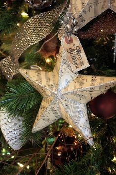 an ornament hanging from the christmas tree with sheet music notes on it's star