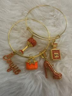 Orange Bling shoe, perfume bottle, purse and wine glass charm Vintage Charm Bracelet For Party, Chic Gold Charm Bracelet Gift, Chic Gold Charm Bracelet For Gift, Handmade Trendy Charm Bracelet For Party, Chic Gold Charm Bracelet As Gift, Trendy Party Charm Bracelet With Lobster Clasp, Trendy Charm Bracelet For Parties With Lobster Clasp, Trendy Charm Bracelet With Lobster Clasp For Parties, Shoe Perfume