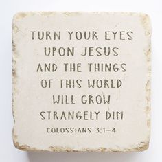 a stone block with the words, turn your eyes upon jesus and the things of this world will grow strangely dim